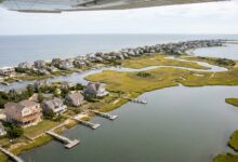 Aerial view of South Shore coastal homes showing elevated waterfront properties and barrier island development