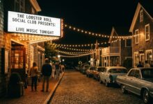 A small music venue entrance illuminated at night in an East End village setting