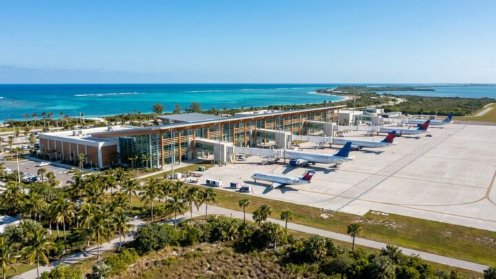 Regional airport terminal with aircraft and coastal Florida landscape