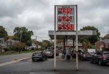 Gas station price sign showing elevated fuel prices at Long Island suburban service station